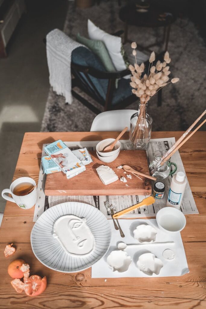 An artistic pottery workspace with tools, clay, and creative decor perfect for home crafting.